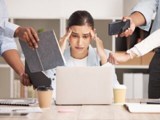Stress, anxiety and multitasking business woman with headache from workload